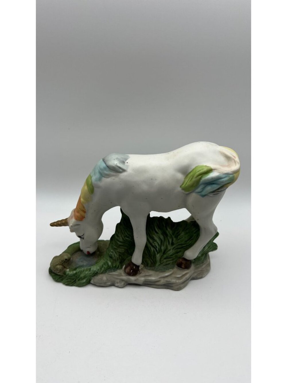 Hand-Painted Ceramic Unicorn Figurine Grazing On Grassland Scene